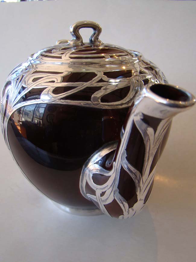 An absolutely stunning scarlet red ceramic teapot with unbelievable silver overlay circa 1890 — image 4